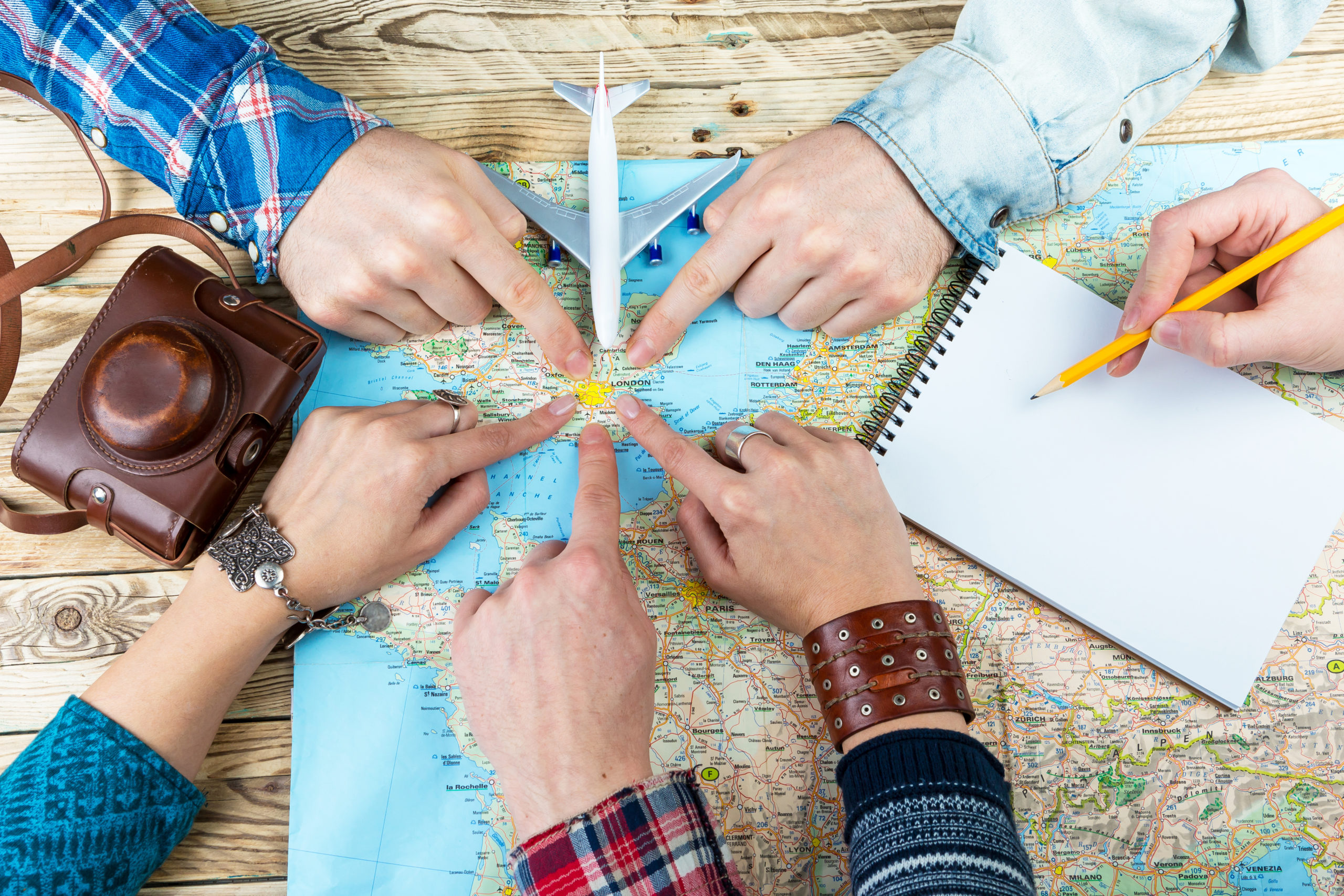 How can you plan group travel to give back?